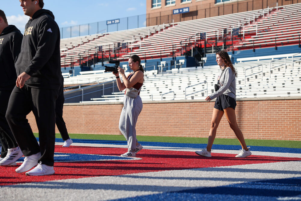 Savannah filming on the football field